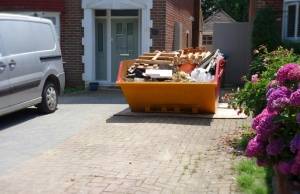 Loaded Skip On Driveway