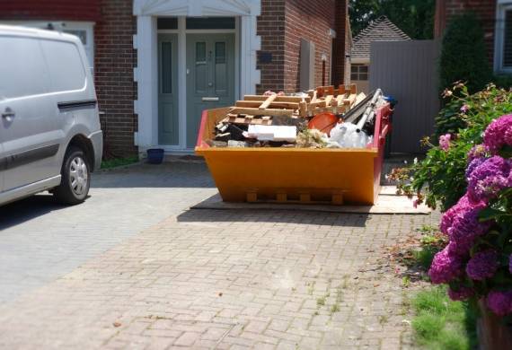 Loaded Skip On Driveway