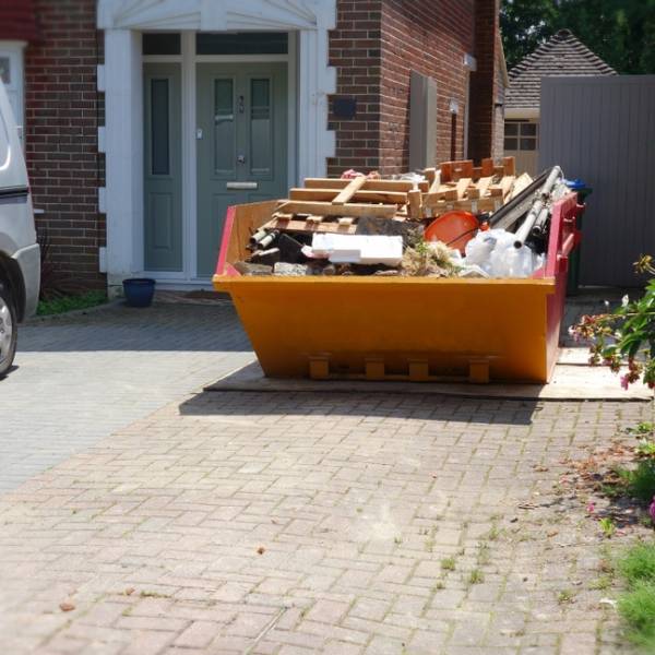 Loaded Skip On Driveway