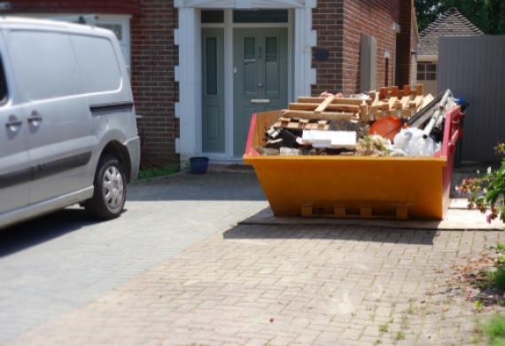 A full skip in a driveway