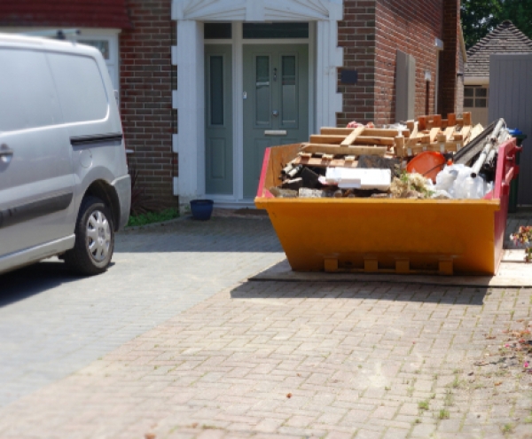 A full skip in a driveway