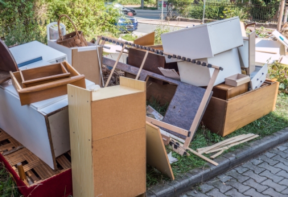 waste management- an assortment of cupboards and drawers on a driveway