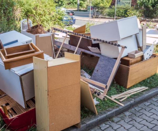 waste management- an assortment of cupboards and drawers on a driveway