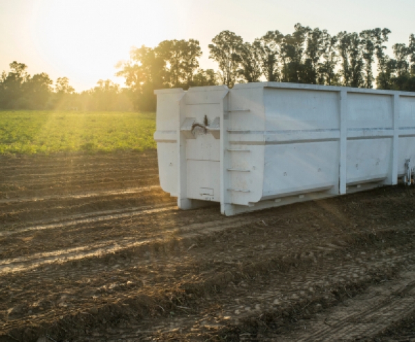 White container in a field