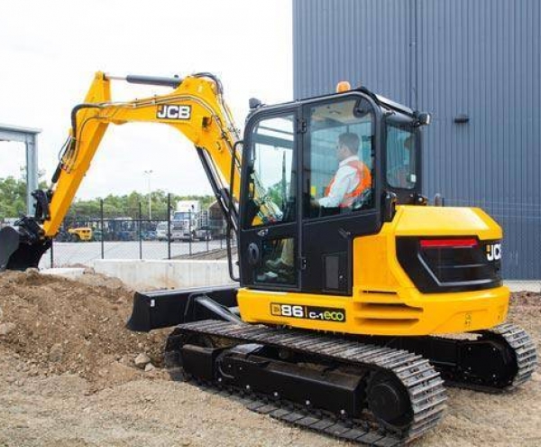 Digger hire in Newcastle-under-Lyme- a JCB digger digging up soil