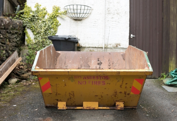 mini skip hire on a driveway