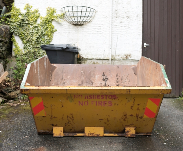 mini skip hire on a driveway